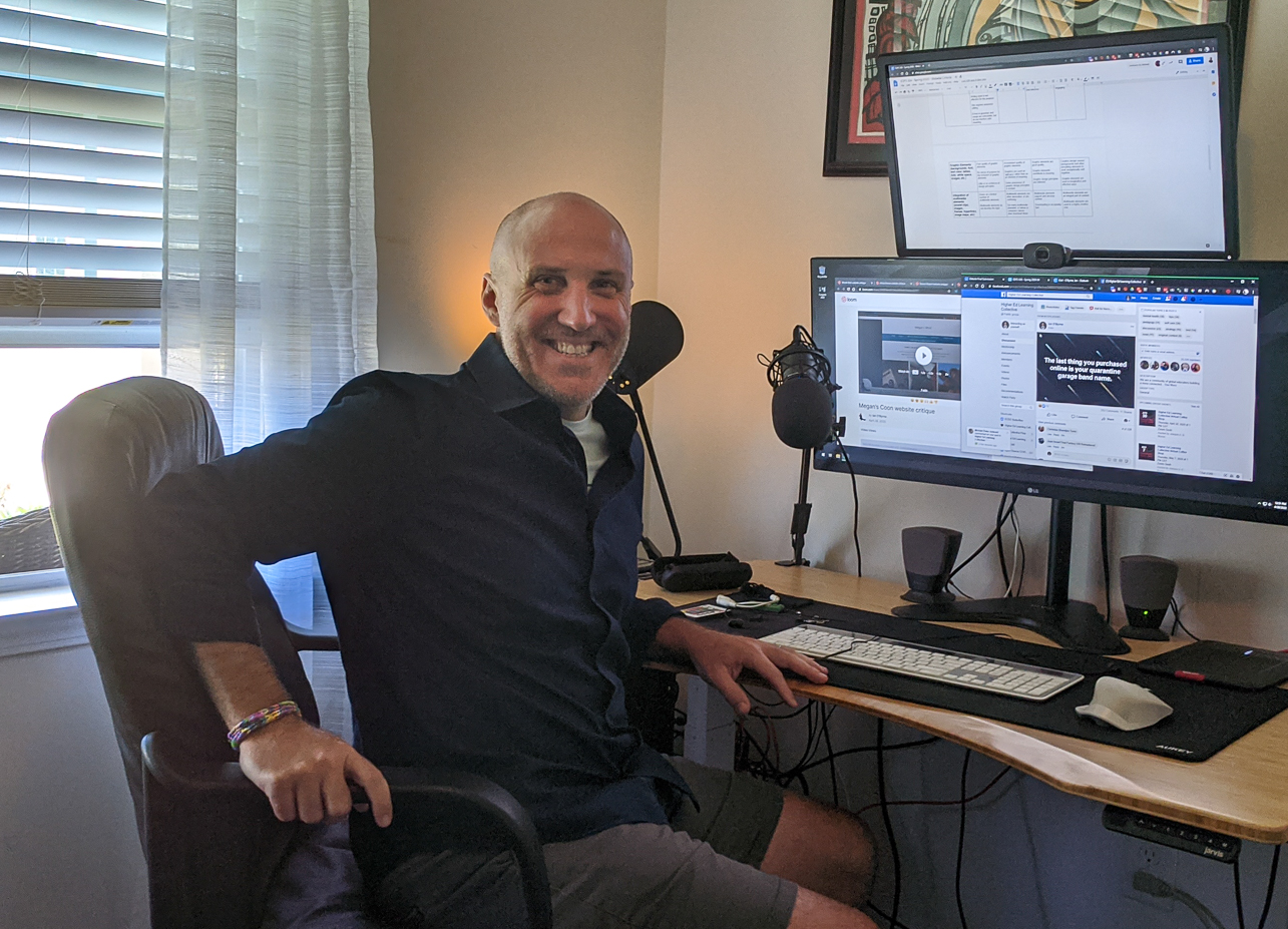 Professor Ian O'Byrne sits at his home office desk during the COVID-1( Pandemic.