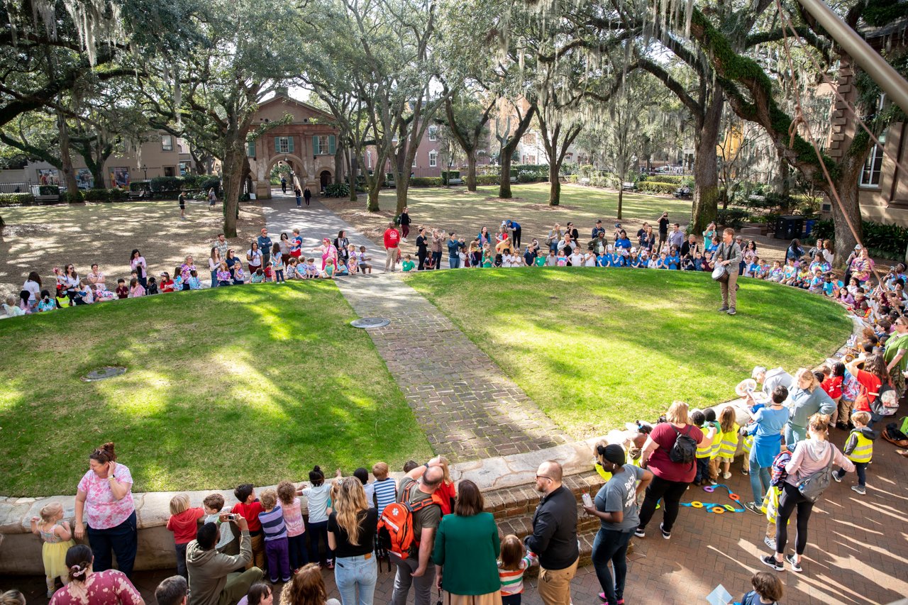 children gather around Cistern