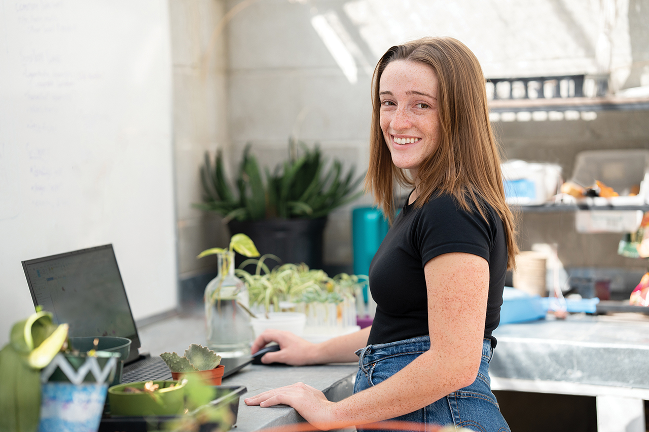 Sophia Mucci in the Greenhouse work station on campus