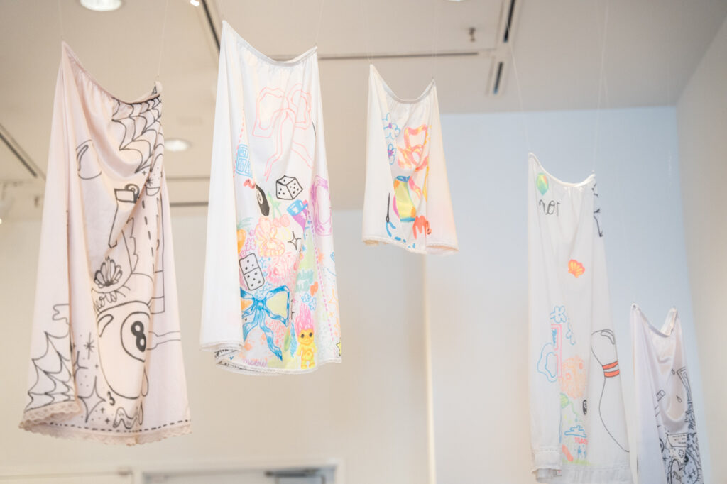 clothing art hanging from the ceiling of the Halsey Gallery 