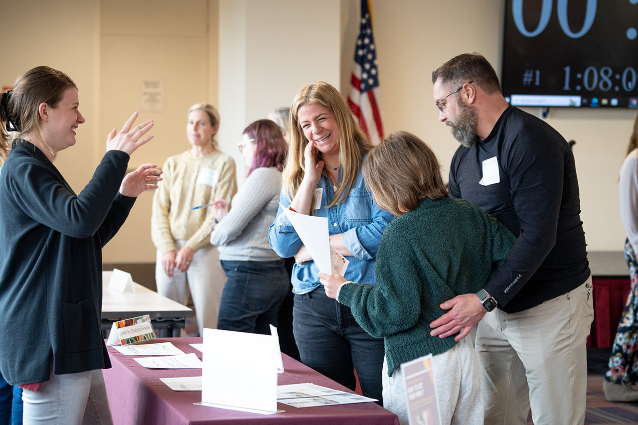 families gather information at REACH Open House