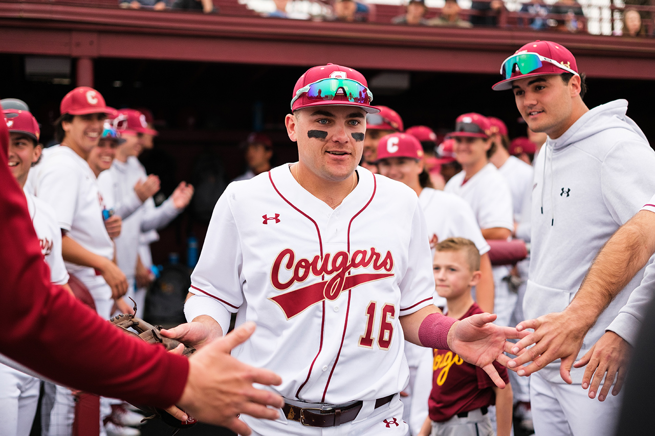 slapping hands out of dugout 