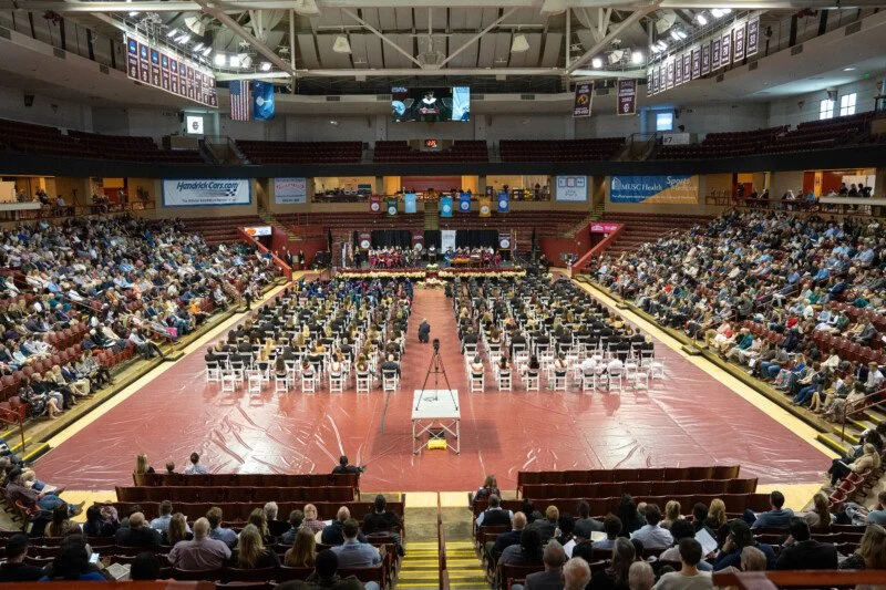 Aerial view of the graduates and the audience inside the TD Arena. 