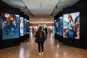 A student walking in the hallway of the IAAM Museum. 