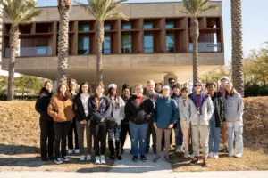 A group of students standing in front of the African American Museum.