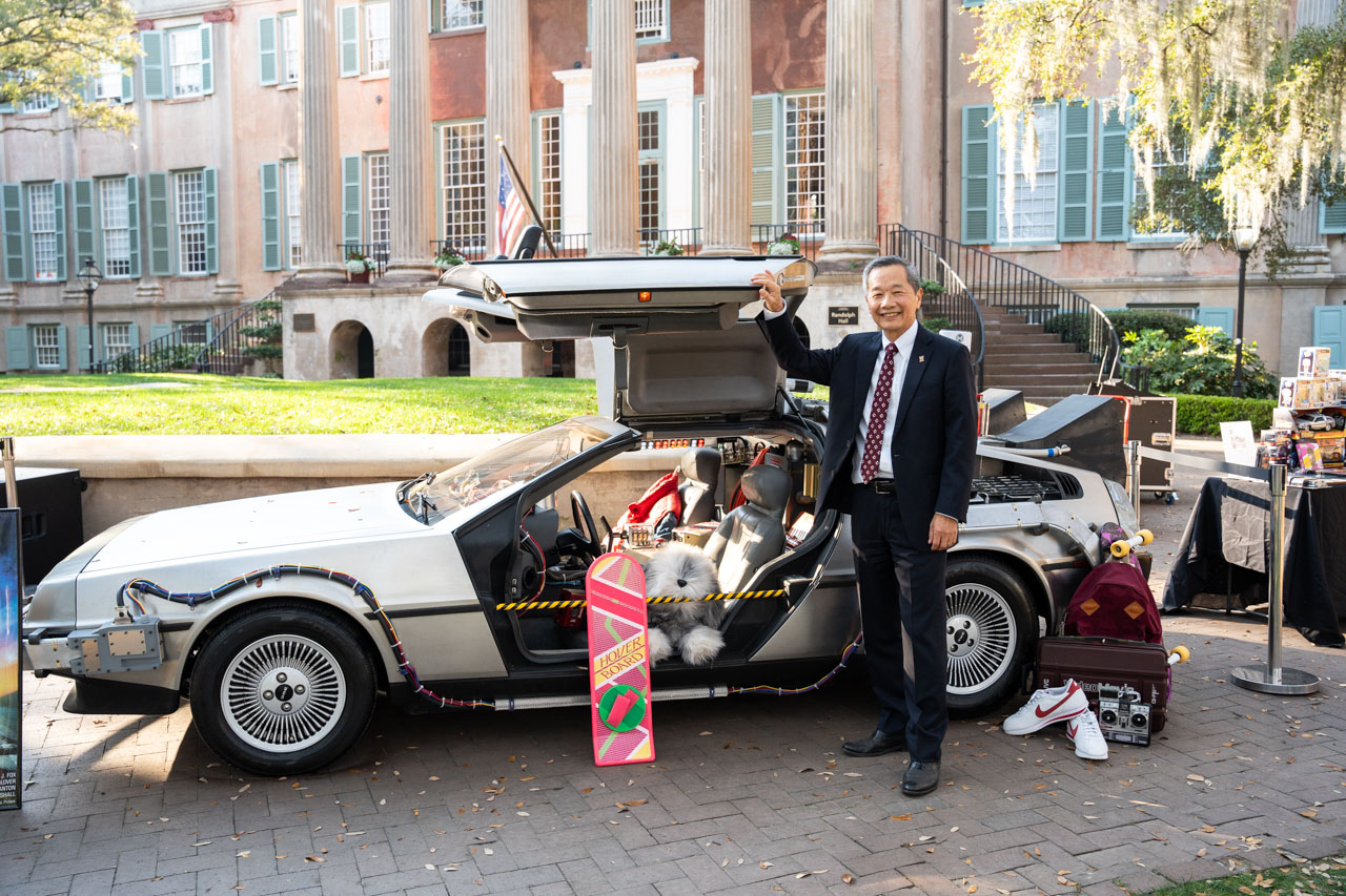 President Hsu poses with a Delorean on CofC Day 2024.