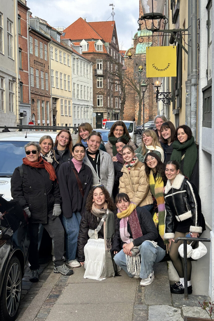 College of Charleston students pose together on the street in Europe 