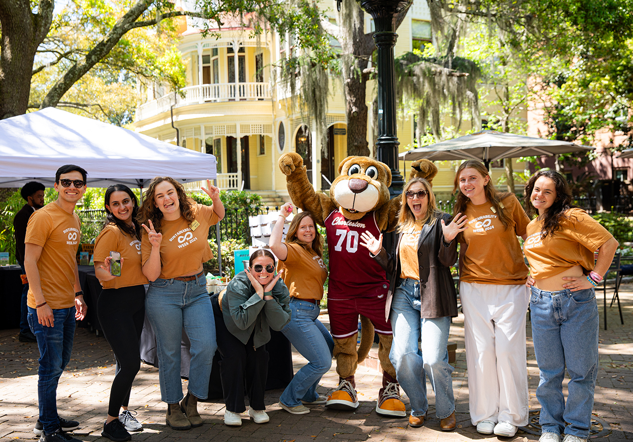 Center for Sustainability staff pose for a group picture at Sustainability Fair with Clyde the Cougar. 