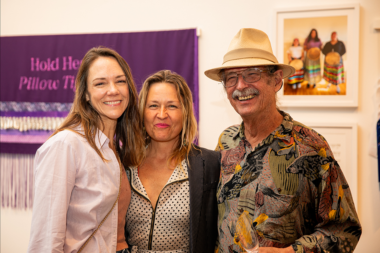 Halsey attendees mingle at Harkins' exhibit titled Teach Me a Song.