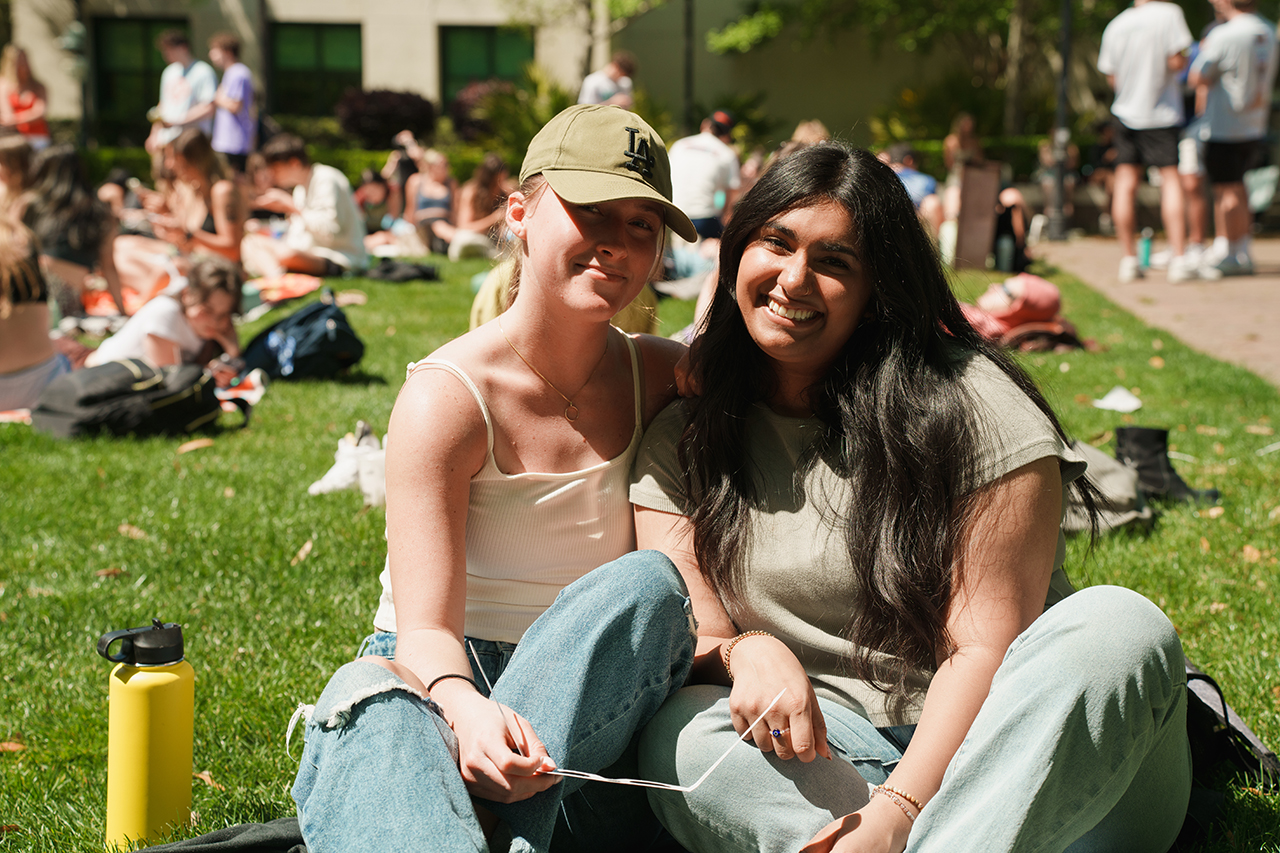 Students gather on Rivers Green looking up at the partial Solar Eclipse 