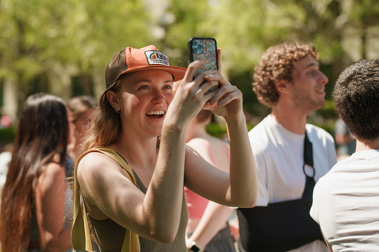 Students gather on Rivers Green looking up at the partial Solar Eclipse 