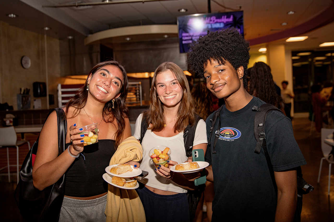 Students pose at Moonlight Breakfast at Liberty Fresh Food Company.