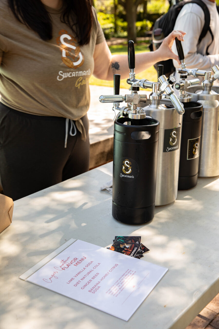 Handcrafted soda is poured at soda popup at Rivers Green.