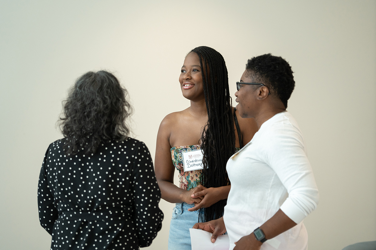 women gather and talk at the Simons Center Soft Opening 