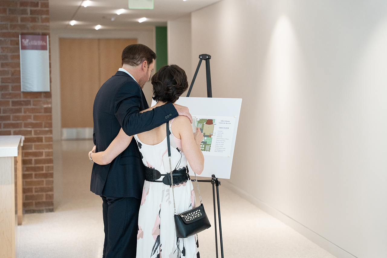 guests look at plans for the Simons Center for the Arts 