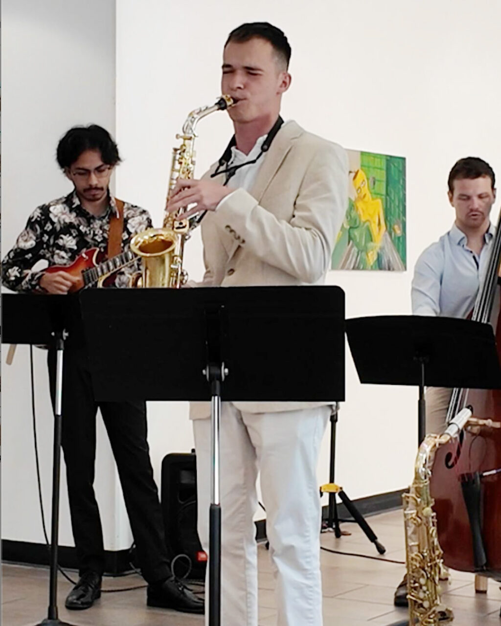 Student plays saxophone during young artist series 