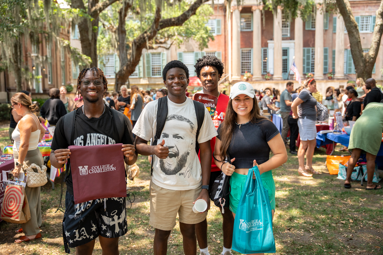 posing for photo at new student orientation fair