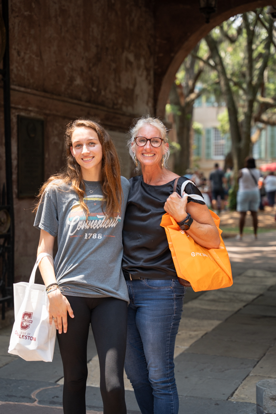 mom and daughter pose at new student fair 