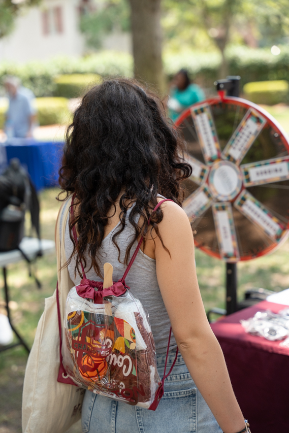 spinning the wheel at the new student orientation fair