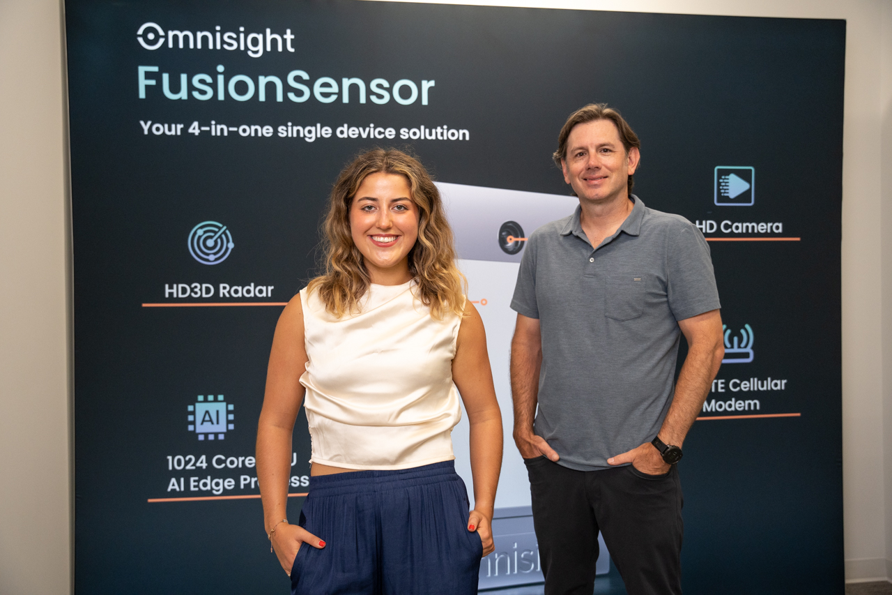 Julia Skaldzinski internship poses with her College of Charleston adjunct professor at Omnisight