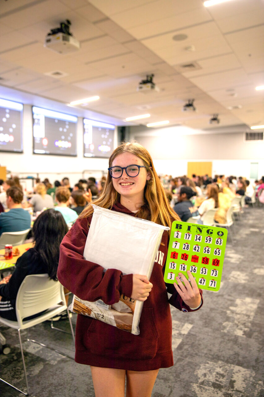 Student shows prize from winning Bingo at CAB Back to School Bingo 