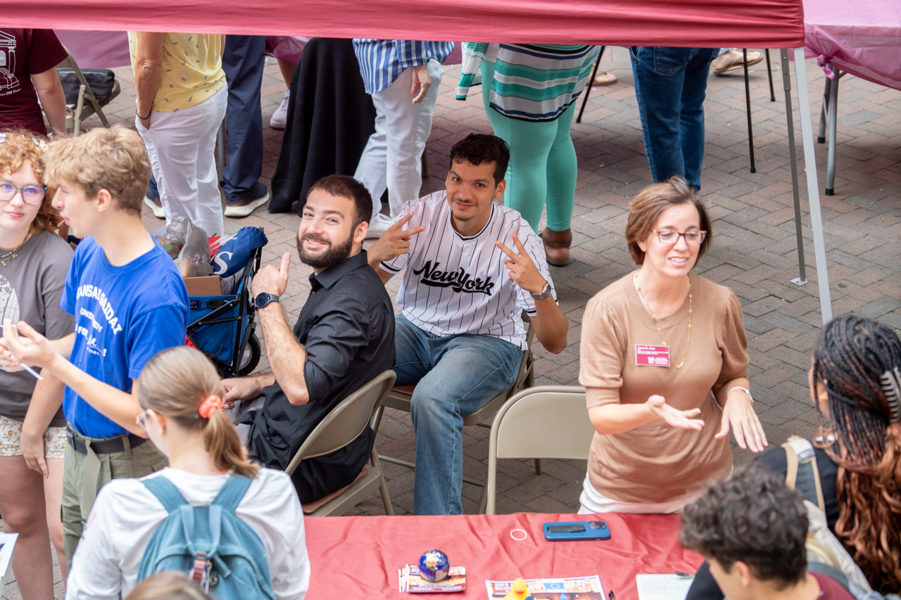 smiling for the camera at the Study Abroad Fair in the Cougar Mall