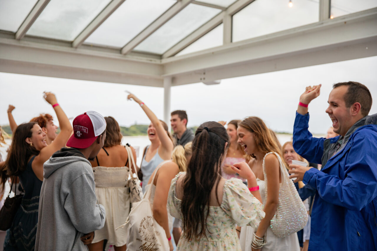 Students dancing at CAB Harbor Cruise event.