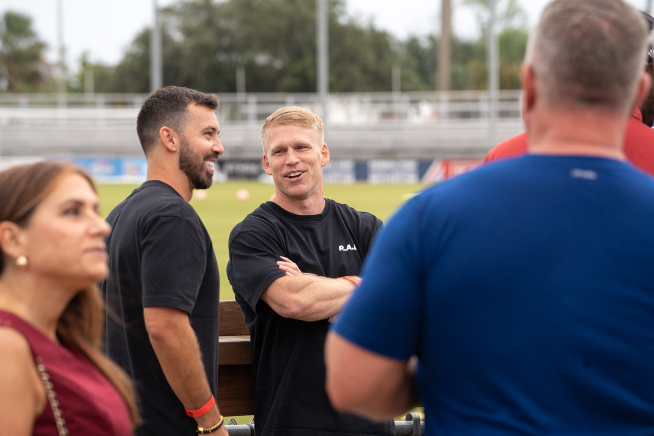 alumni gather at the Men's soccer game