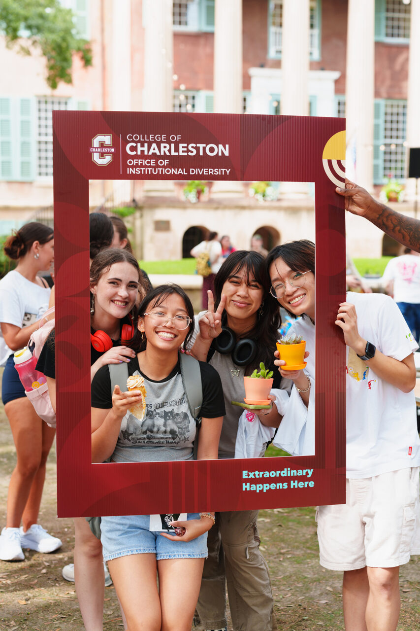 posing with sign at