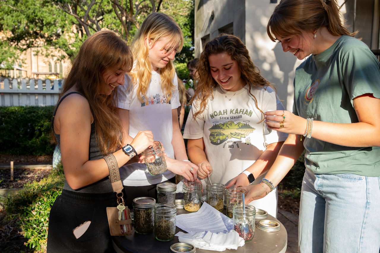 Students make personalized tea bags at Garden Work Day with locally grown herbs and dried plants.