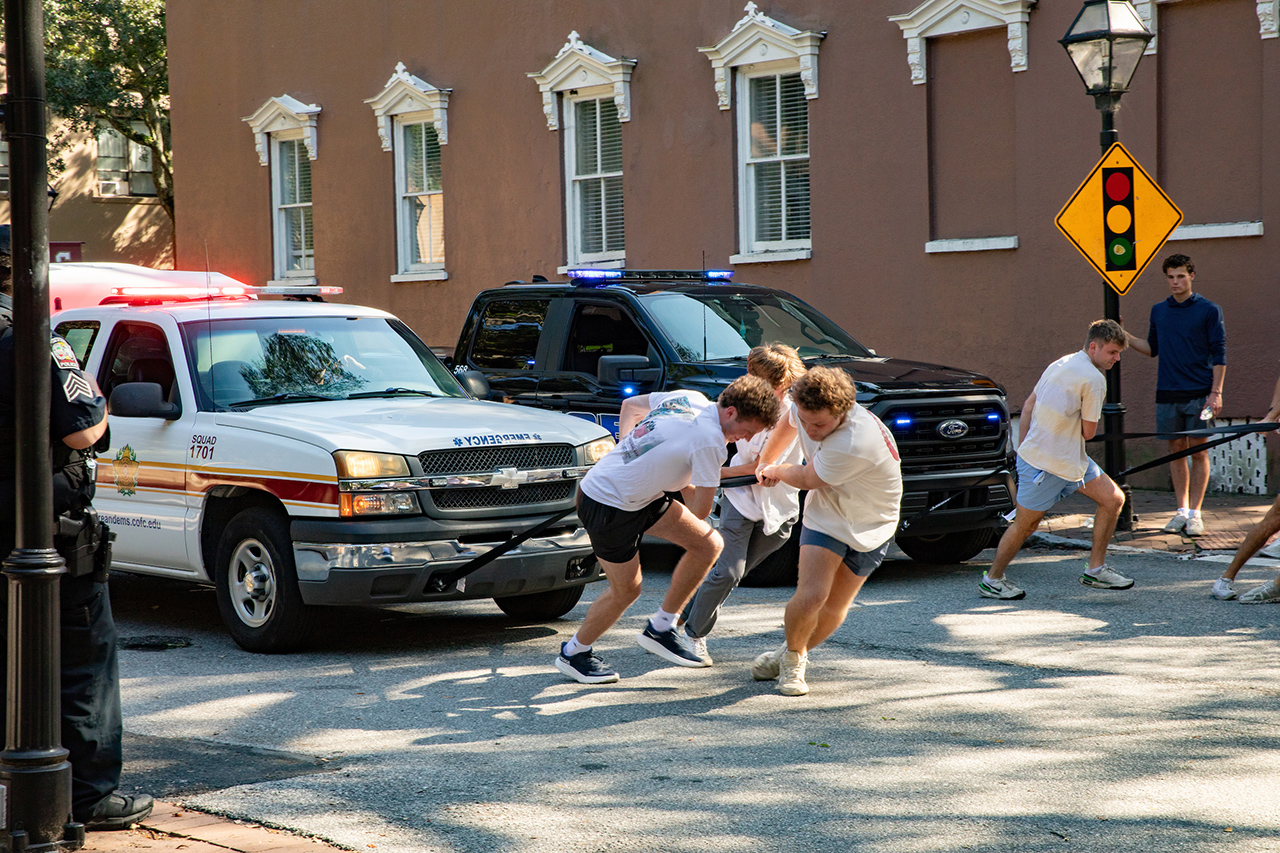 Members of the Pi Kappa Alpha Fraternity pull vehicles to raise money for their philanthropy.