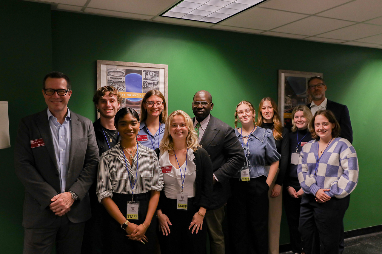 Jamelle Bouie, NYT columnist, group photo with CofC student volunteers and faculty.