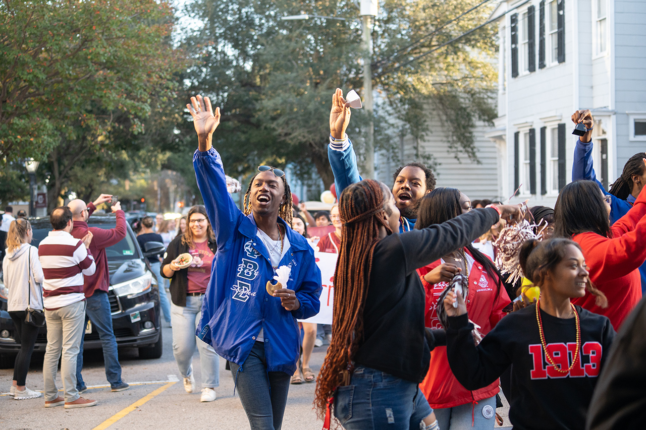 waving during homecoming parade 