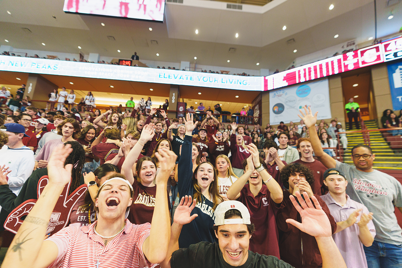 students celebrate at College of Charleston Men's Basketball Team home game