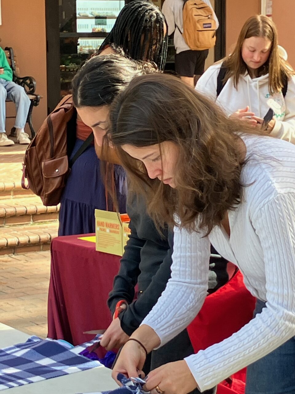 students volunteer for the local community in Cougar Mall