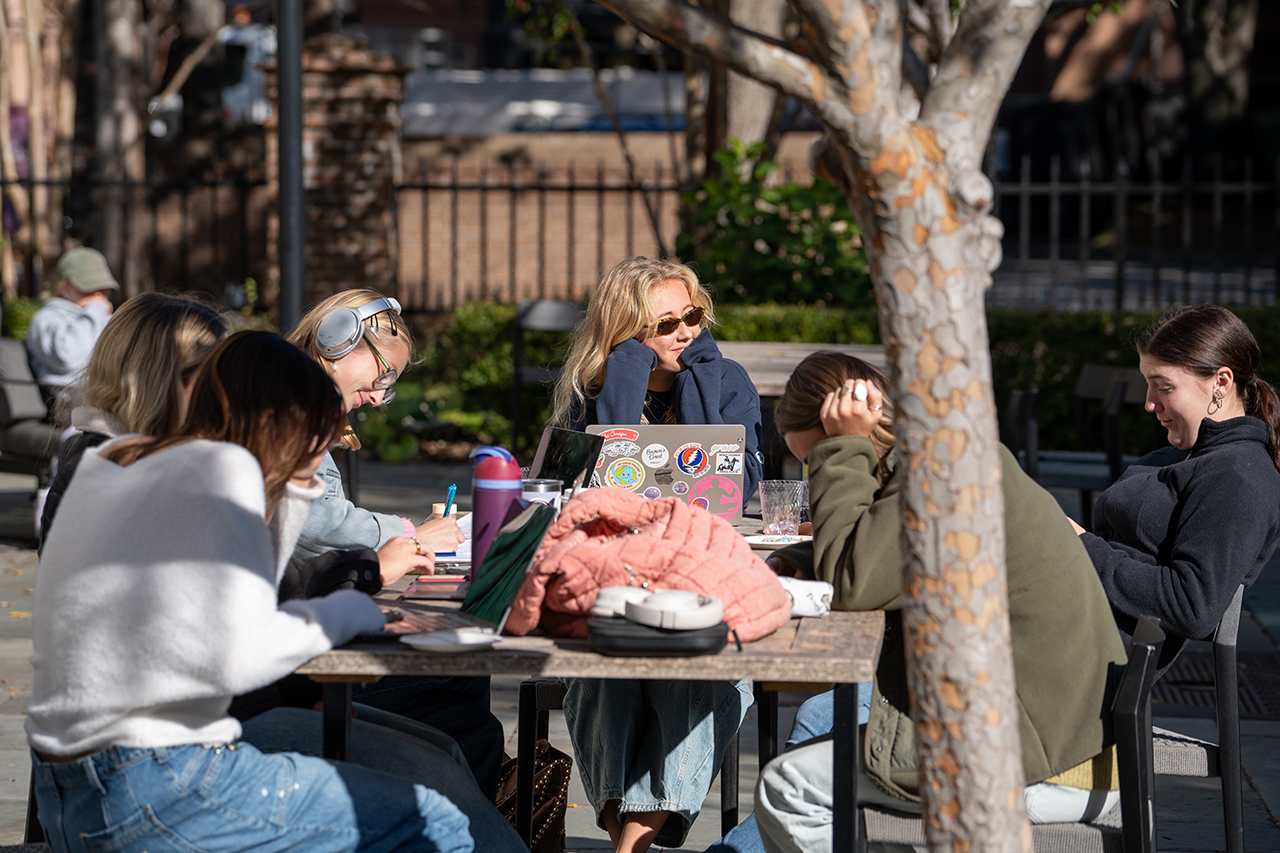 students study outside library