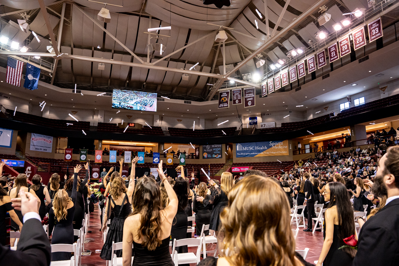 diploma toss at winter graduation at the College of Charleston