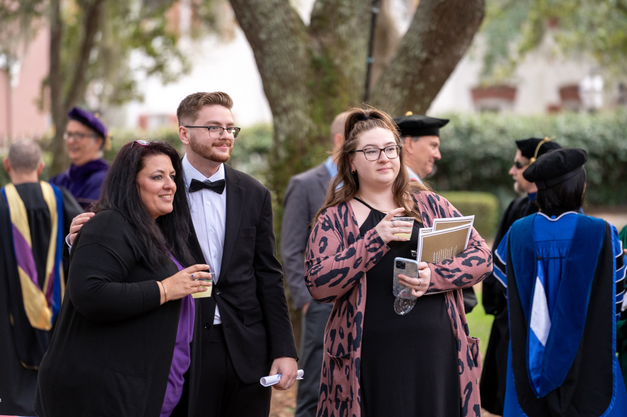 families gather in the cistern for photos winter graduation at the College of Charleston