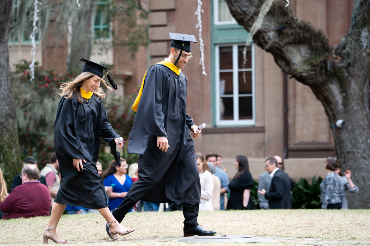 winter graduates crossing the cistern