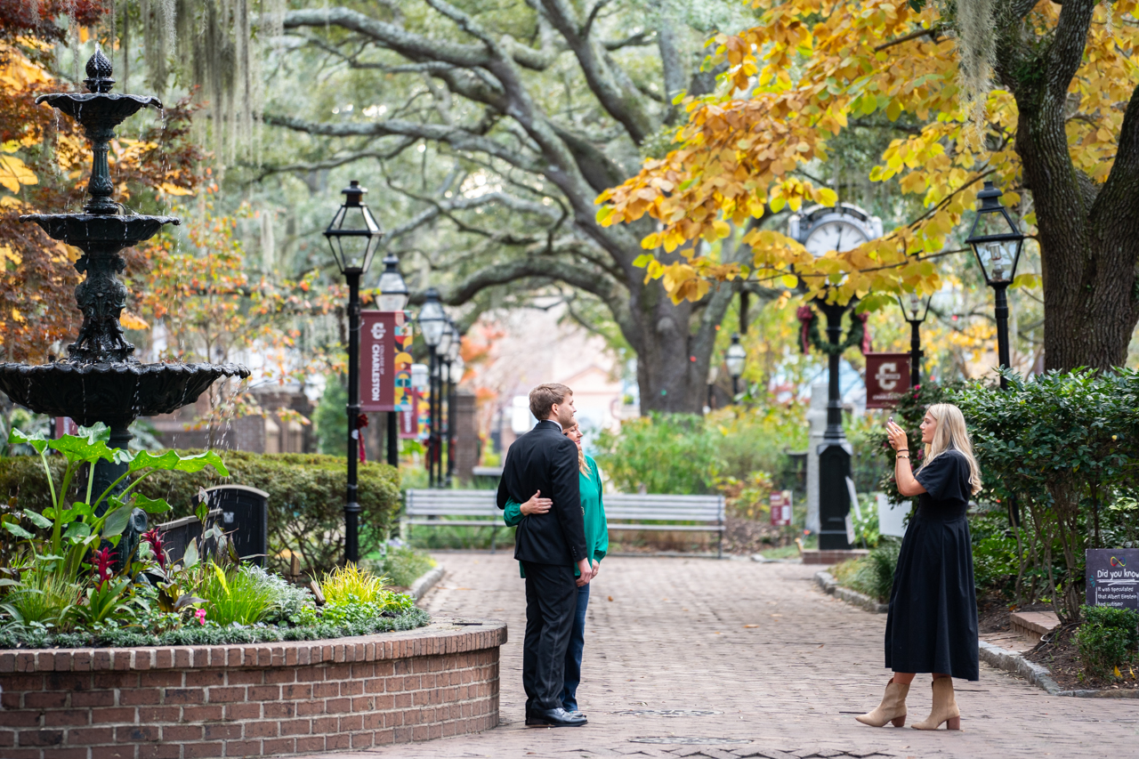 taking photos on campus after winter graduation at the College of Charleston