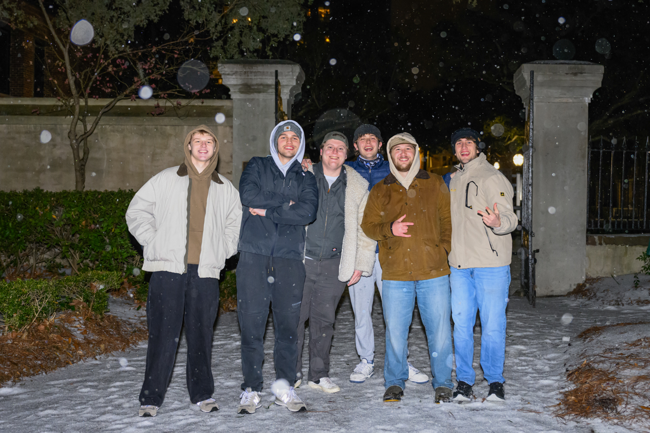 Students play in the snowstorm on campus 