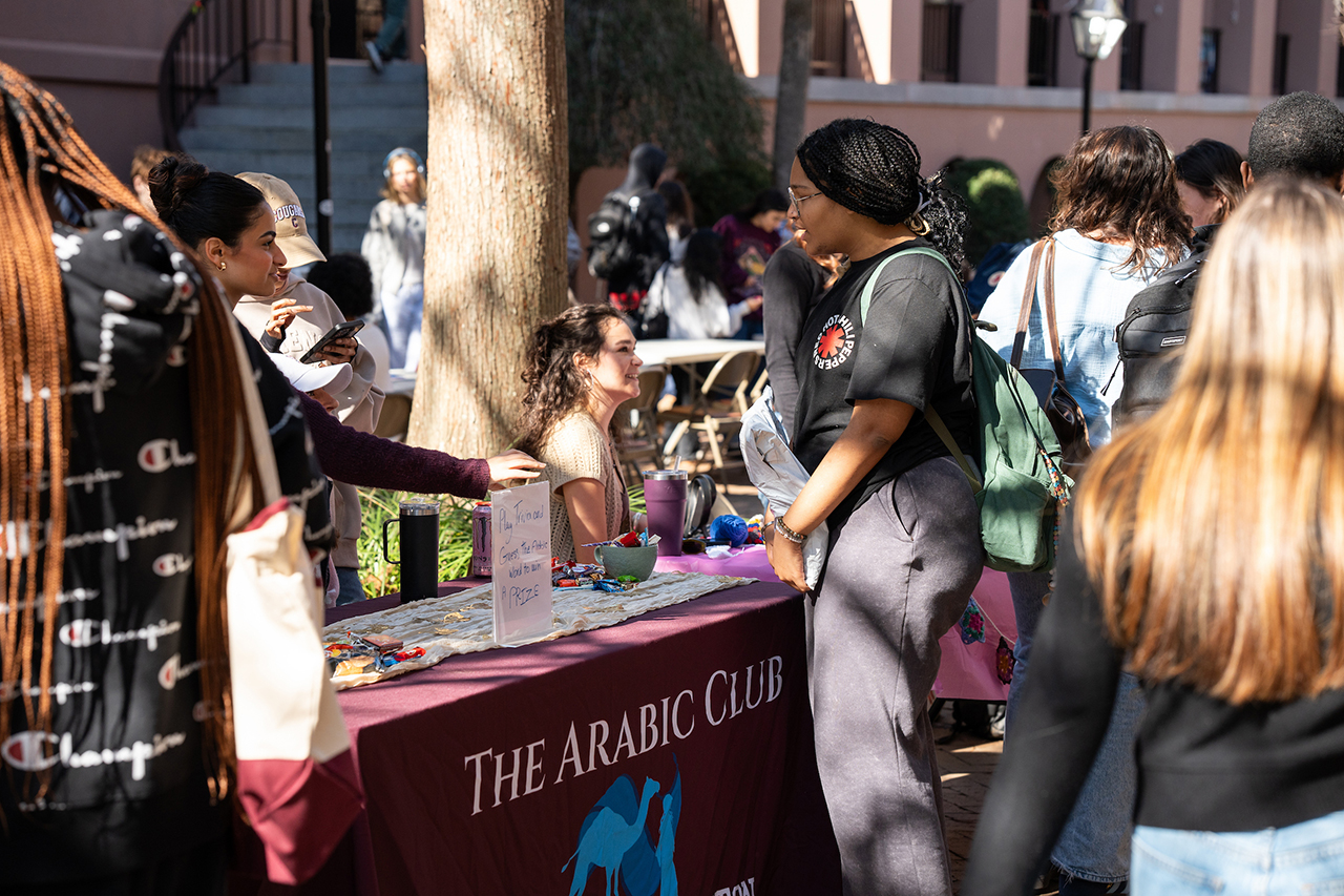 students discuss Arabic club in the Cougar Mall 