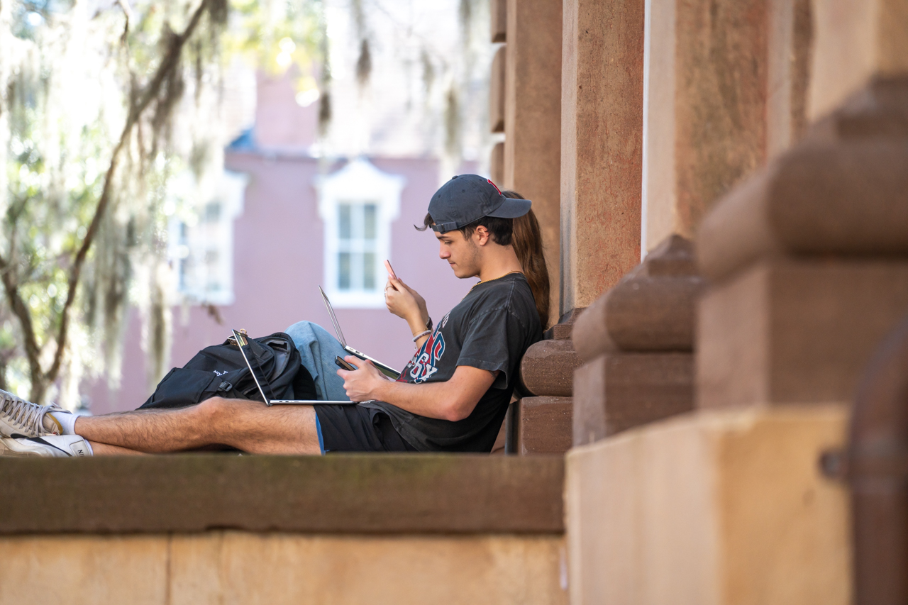 reading on the Towell library steps 