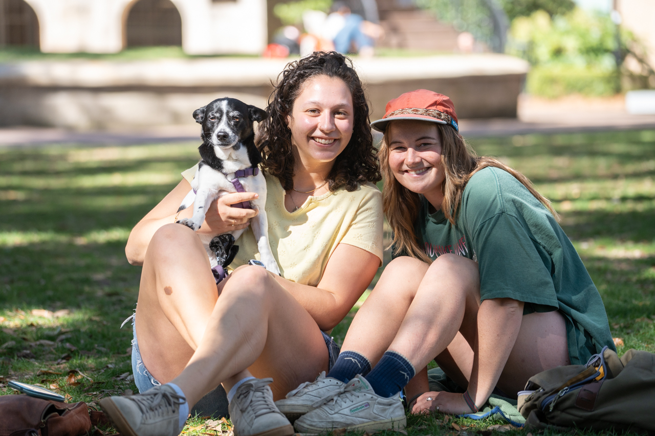 posing with their dog at the College of Charleston