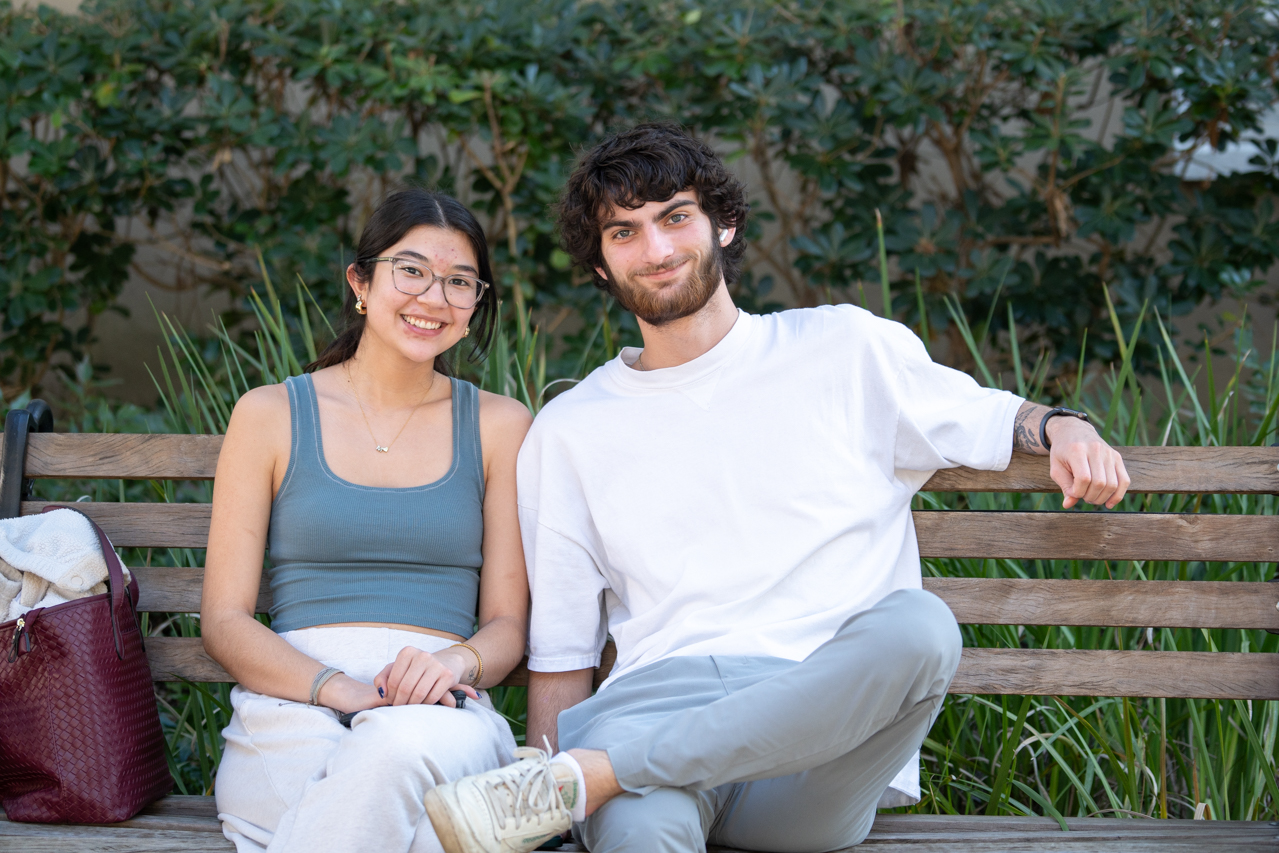 friends posing together on a bench 