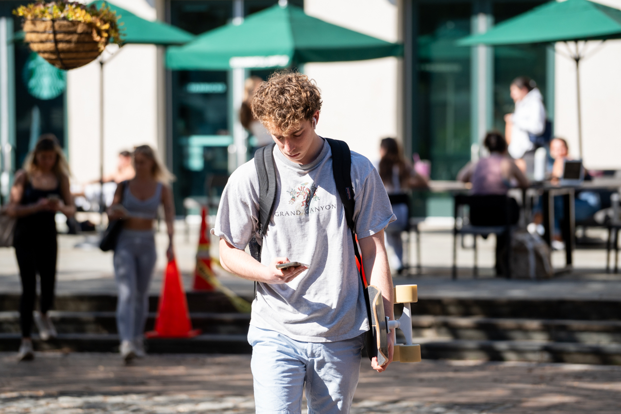 walking to class with skateboard 