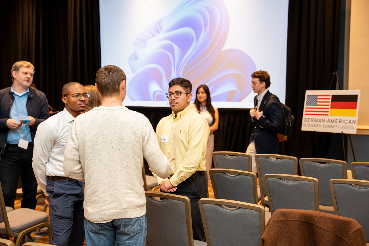 students participate in a networking event at the German-American Business Summit