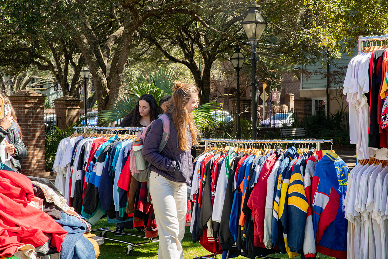 Students shop at a pop-up secondhand clothing market called Flea-Ji put on by the FiJi fraternity at Rivers Green.