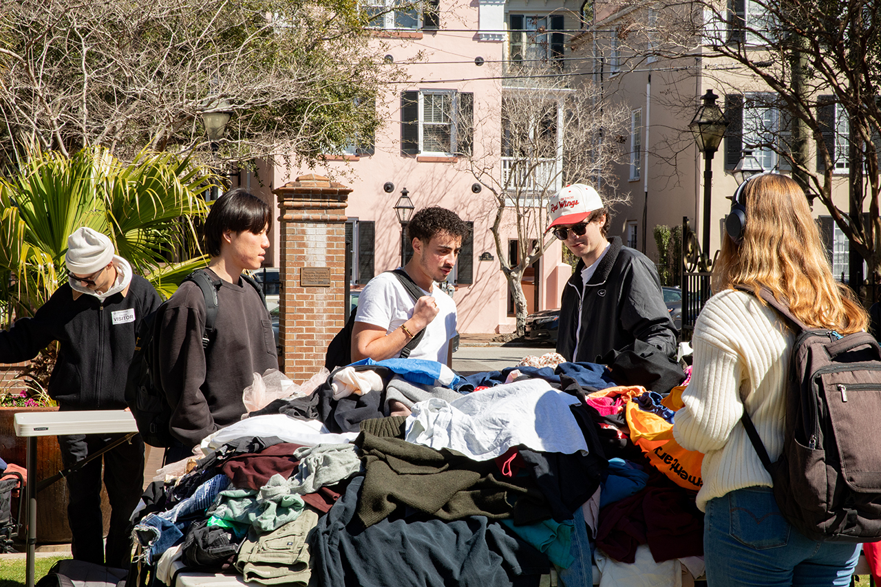 Students shop at a pop-up secondhand clothing market called Flea-Ji put on by the FiJi fraternity at Rivers Green.