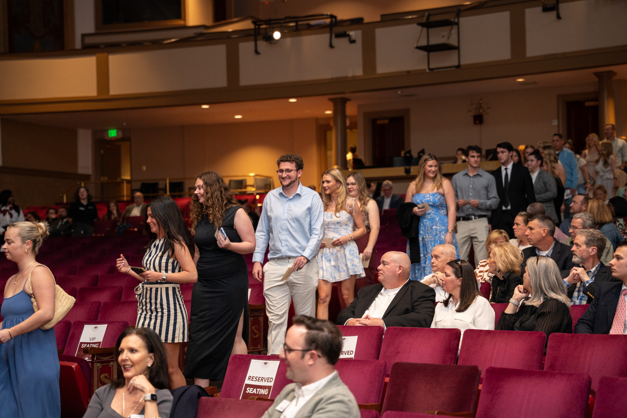 students walk down the aisle at the Sotille Theater 